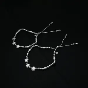 Silver Anklet with Three Flower Motifs and Beaded Detailing.